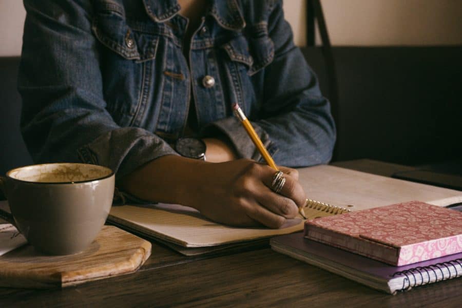 Women writing notes brainstorming ideas