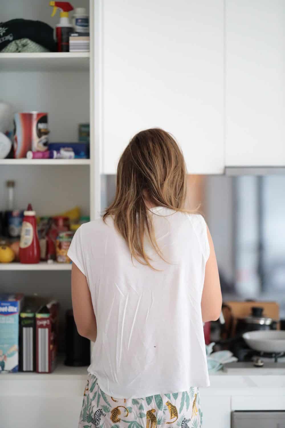 Lady cleaning out pantry