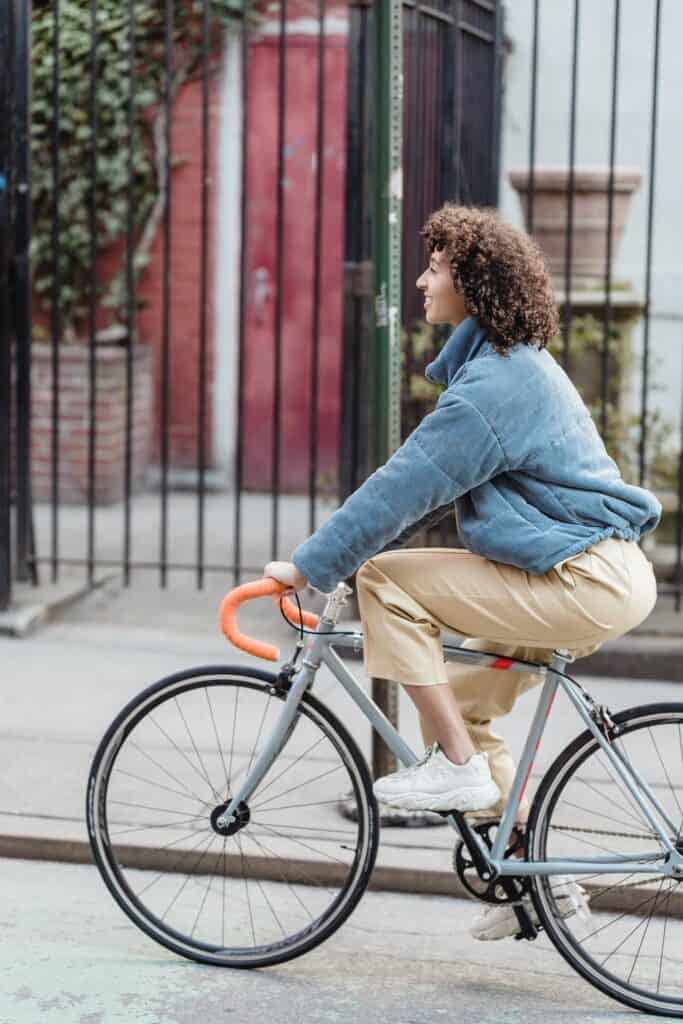 woman on bicycle - an example of an environmental vegan