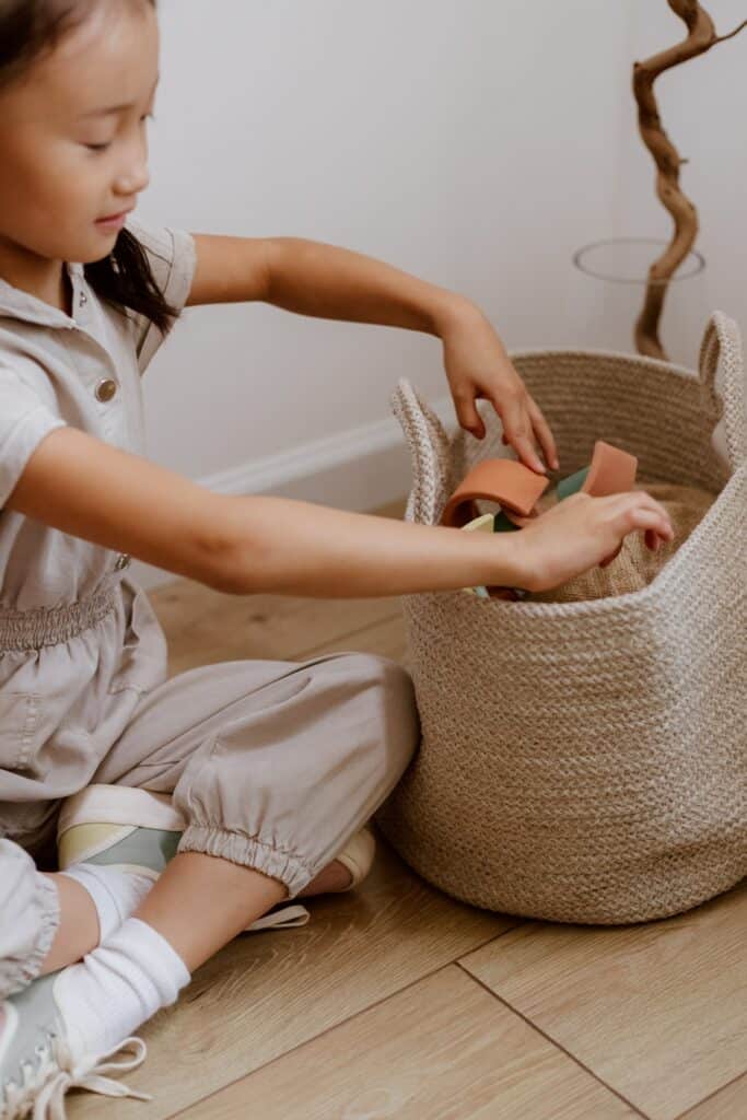 girl tidying up her clothes